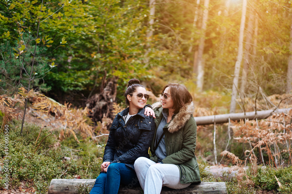 two beautiful girls sat down in the forest