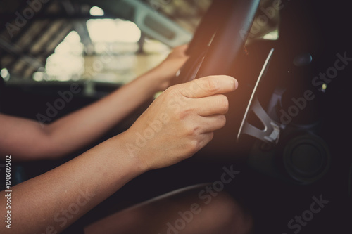 hand on steering wheel. driver . travel on holiday