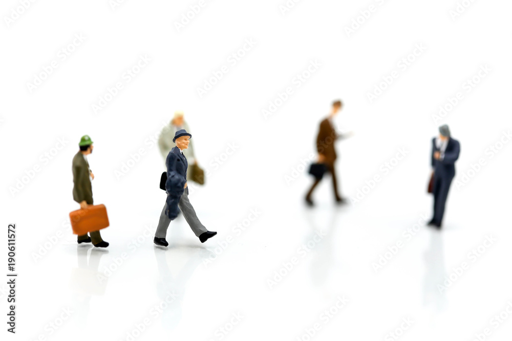Miniature people : Businessmans make handshaking agreement with the big group of the small business Miniature people : Businessmans make handshaking agreement with the big group of the small business