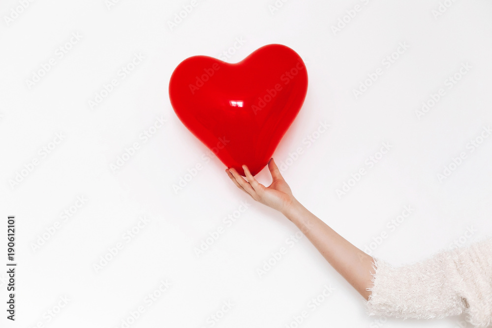 hand holding heart. happy valentine's day concept. red heart balloon on white background with space for text. health care, medicine and blood donation concept. love and protection hand holding heart. happy valentine's day concept. red heart balloon on white background with space for text. health care, medicine and blood donation concept. love and protection