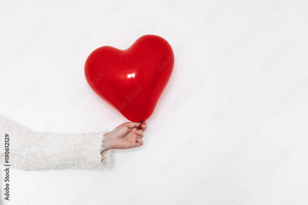 Fototapeta premium red heart in hand, isolated on white. happy valentine's day concept. healthcare, medicine and blood donation donor concept. love and protection . space for text.