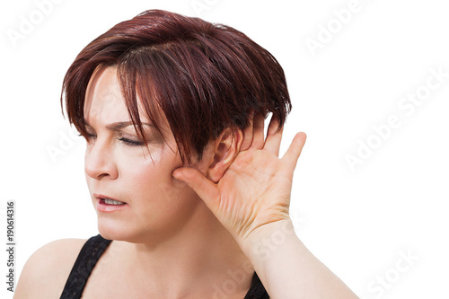 Beautiful woman portrait with short red hair keeping an ear out for something