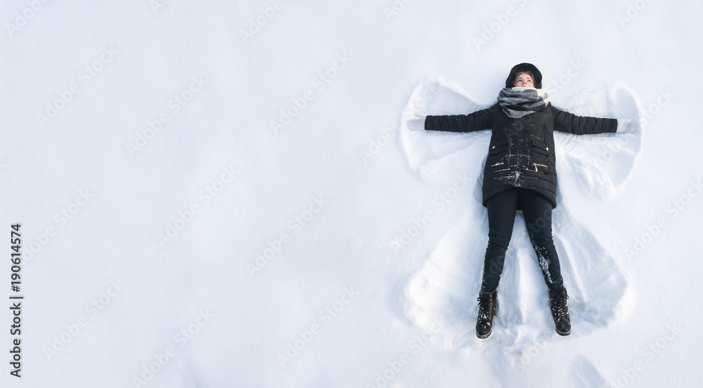 Girl in the snow angel shows . Winter angel