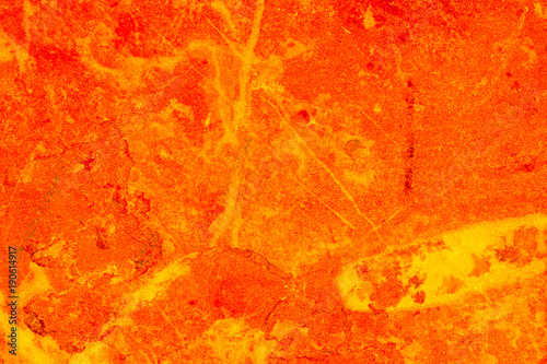 Natural marble slab, creatively red and yellow coloured, ideal for textures, backgrounds and other creative concepts.