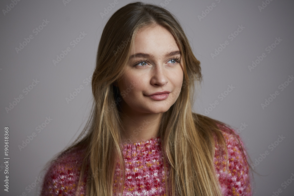 Pretty in pullover girl, studio shot