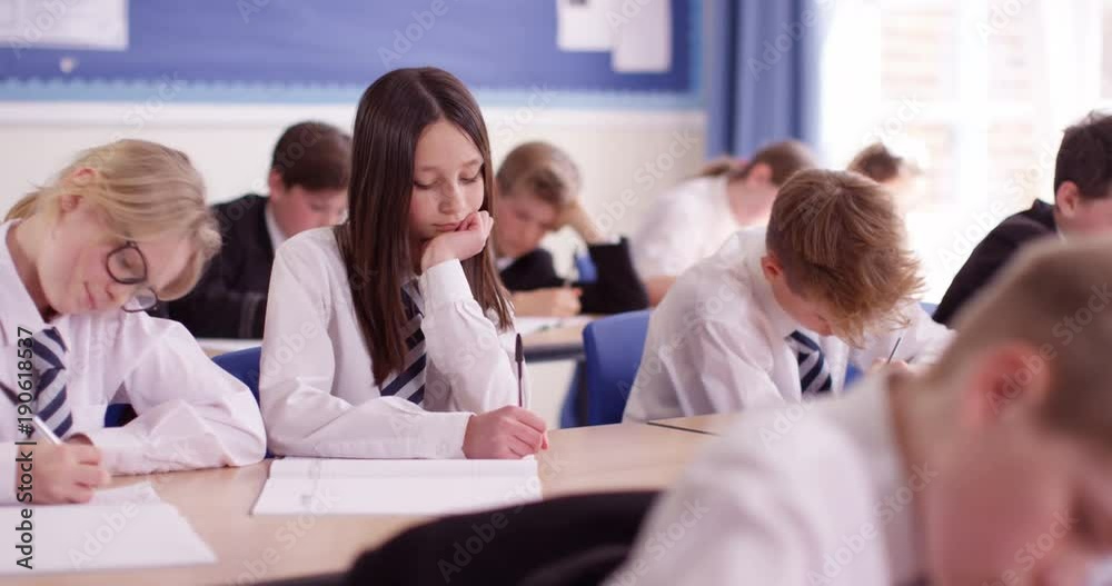 4k, A classroom full of students engrossed in their studies. 4k, A classroom full of students engrossed in their studies.