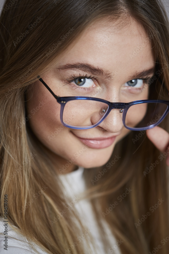 Smiling blue eyes and spectacles girl, close up Smiling blue eyes and spectacles girl, close up