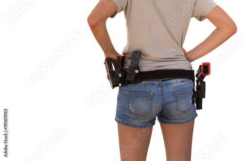 Woman with a gun on her waistband isolated