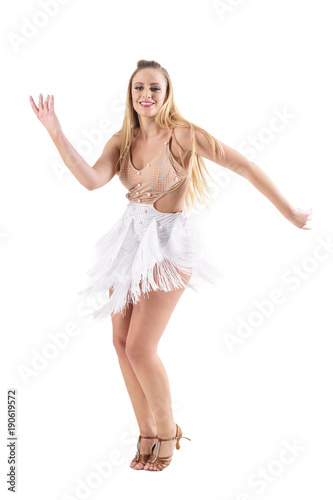 Smiling happy professional caucasian woman dancing latino dances. Full body length portrait isolated on white studio background. 