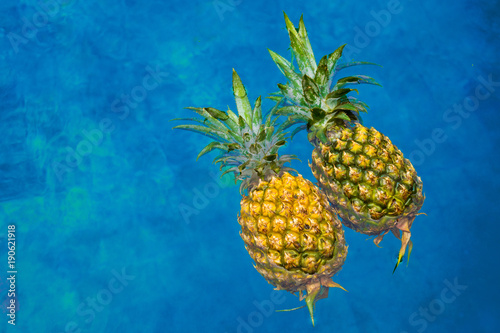 Two pineapples in pool