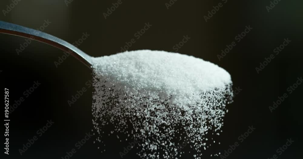 Sugar falling from spoon in super slow motion shot on Phantom Flex 4K