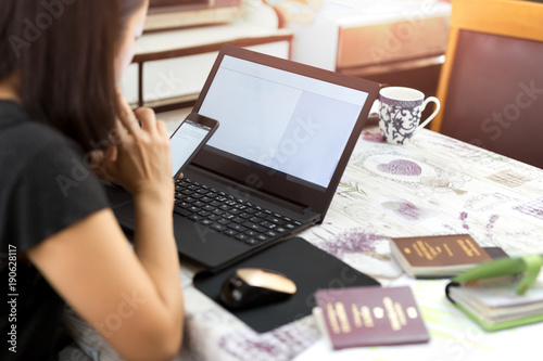 Business woman doing Passport application form fIlling on computer