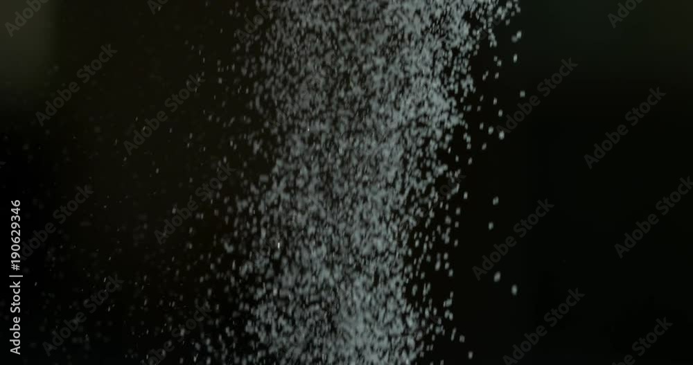 Sugar falling from spoon in super slow motion shot on Phantom Flex 4K