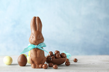 Chocolate Easter bunny and candies on table