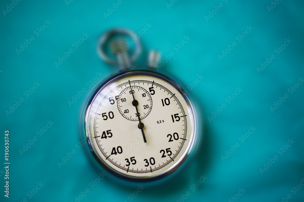 Old stopwatch isolated on paper bright background top view Old stopwatch isolated on paper bright background top view