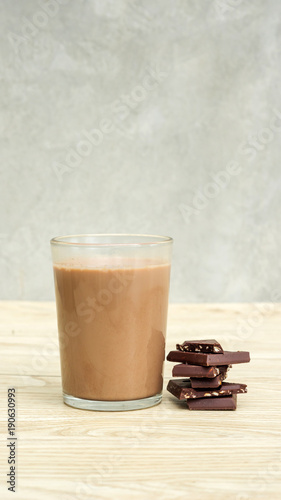 Chocolate milk on a wooden table.