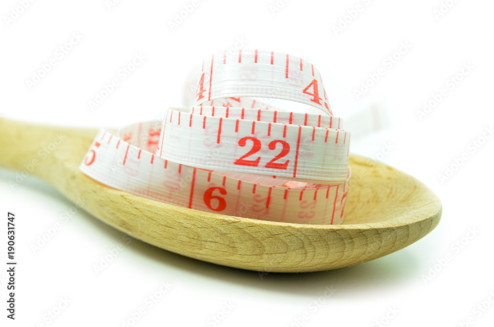White measurement tape with wooden spoon White measurement tape with wooden spoon