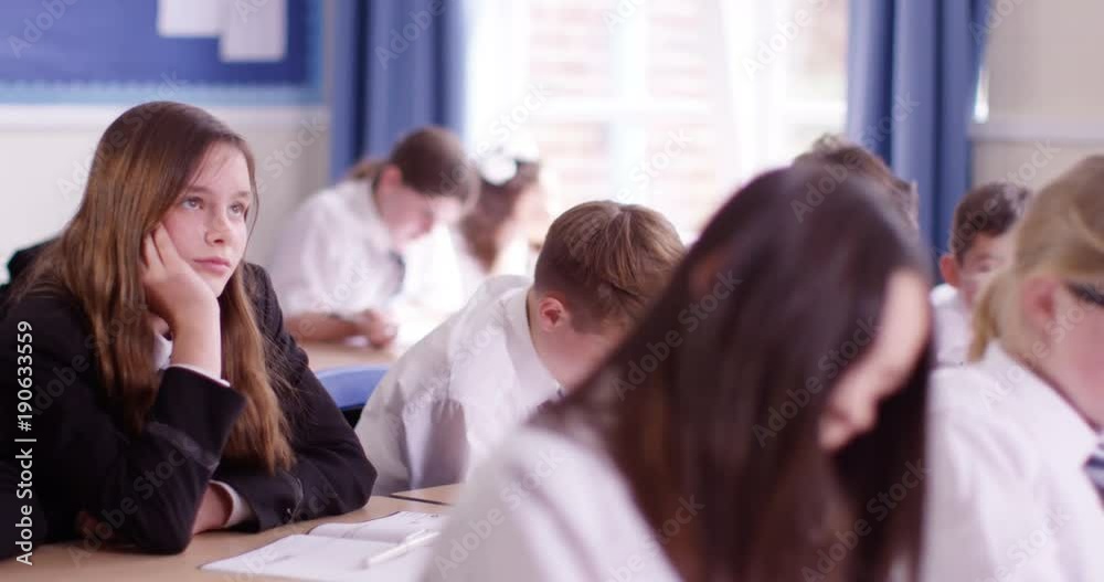 4k Bored school girl day dreaming during a class.Slow motion 4k Bored school girl day dreaming during a class.Slow motion