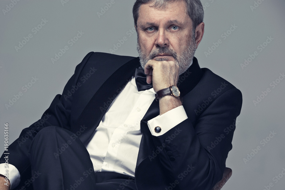 Senior Businessman sitting in chair Senior Businessman sitting in chair