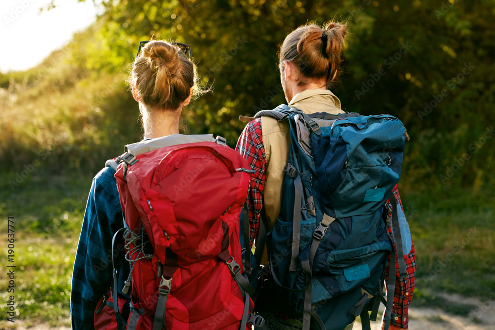 Couple Traveling With Backpack In Nature. Travel