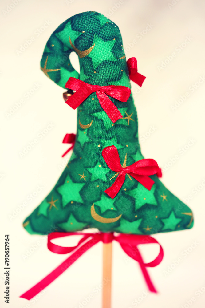 Present green christmas tree with red ribbon
