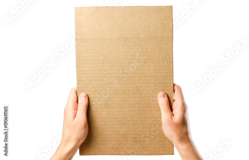 Hands holding a piece of cardboard. Isolated on a white background. Prepared for your text © OB production