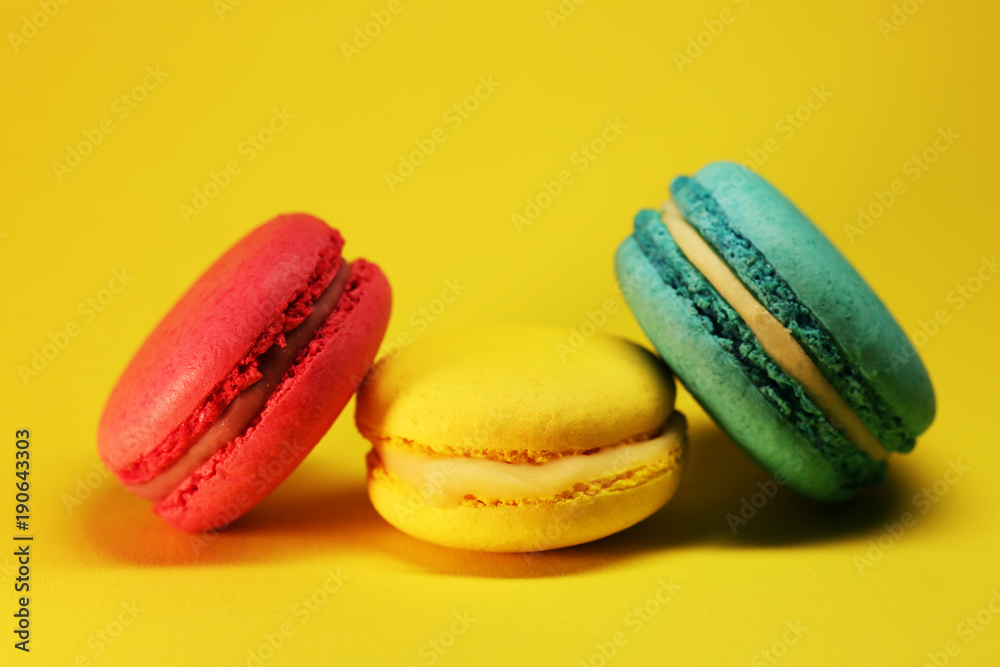 Bright food photography of macroons on yellow background Bright food photography of macroons on yellow background