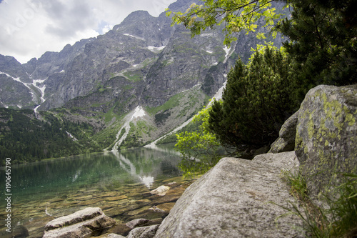 Reflection of Tatra mountain peaks in Morskie Oko lake. Eye of the Sea lake in Tatra mountains, Poland. Polish Tatra mountains Morskie Oko. Tatra mountains. Crystal clear water. Europe