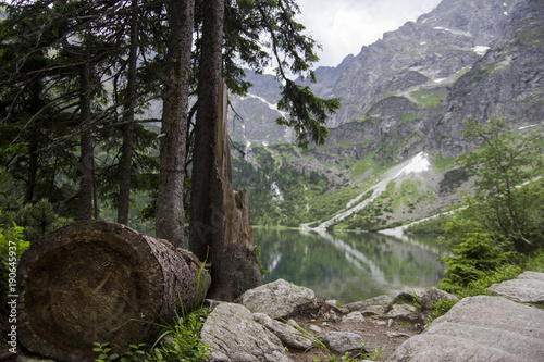Fototapeta Naklejka Na Ścianę i Meble -  Reflection of Tatra mountain peaks in Morskie Oko lake. Eye of the Sea lake in Tatra mountains, Poland. Polish Tatra mountains Morskie Oko. Tatra mountains. Crystal clear water. Europe