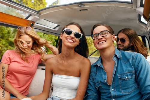 Group Of Friends Having Fun, Traveling In Car In Summer © puhhha