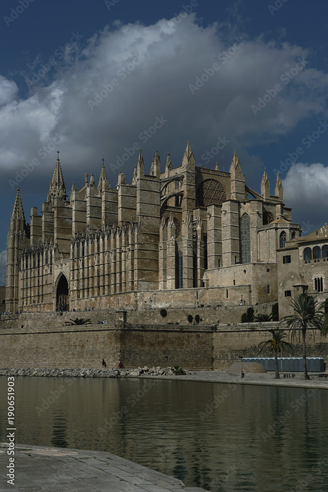 the magnificent Cathedral in the Spanish city of Palma de Mallorca amid the water and the blue sky