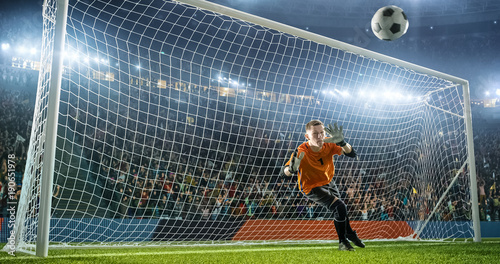 Foto Soccer goalkeeper in action on the stadium