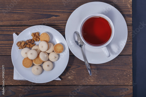 a Cup of tea and a plate of cookies closeup