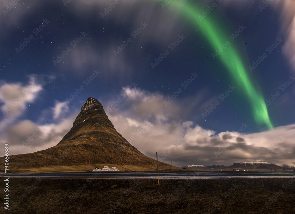 Aurora blasted in sky over Kirkjufell mountain at night, Iceland