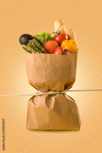 Obraz na plátně Groceries bag representing the concept of belt tightening