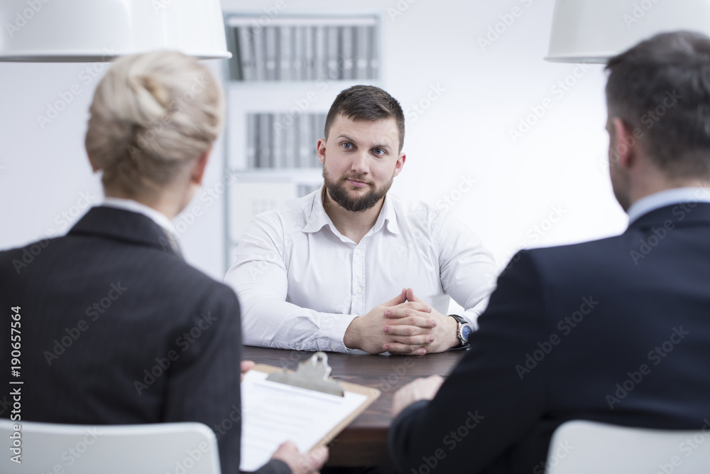 Self-confidence man during job interview Self-confidence man during job interview