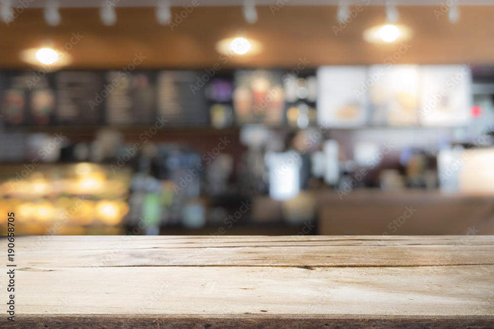 Wood table top on coffee cafe counter bar background