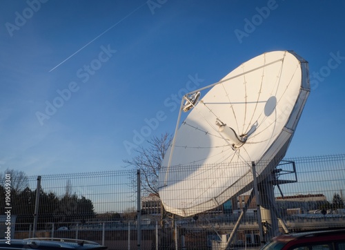 Satellite antenna on background of blue sky