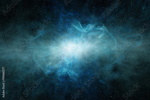 glowing light in a blue interstellar cloud