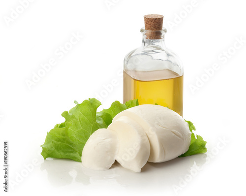Sliced mozzarella ball white lettuce and olive oil