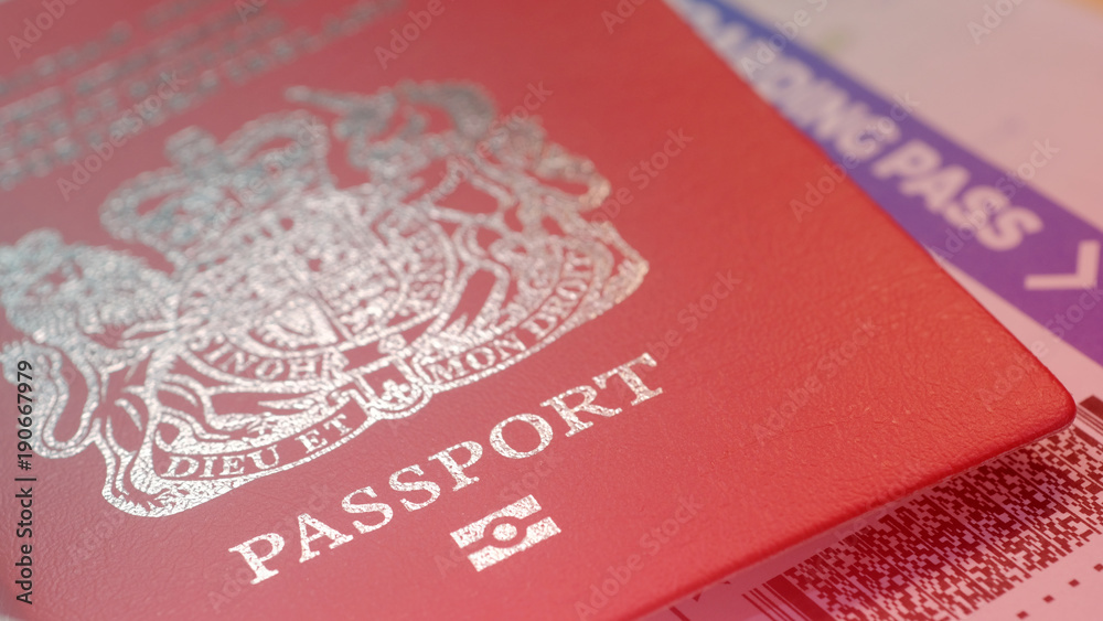 Great Britain citizen passport and a flight ticket for a travel Great Britain citizen passport and a flight ticket for a travel