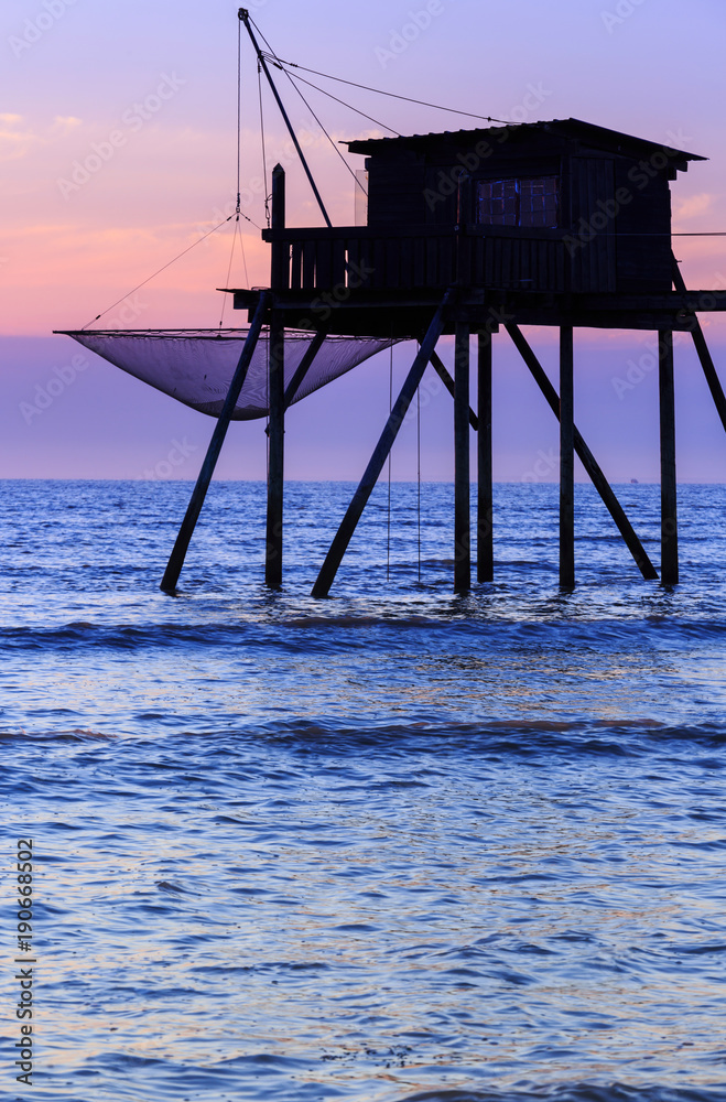 Beautiful view of fishing huts at sunset over the Atlantic Ocean Beautiful view of fishing huts at sunset over the Atlantic Ocean