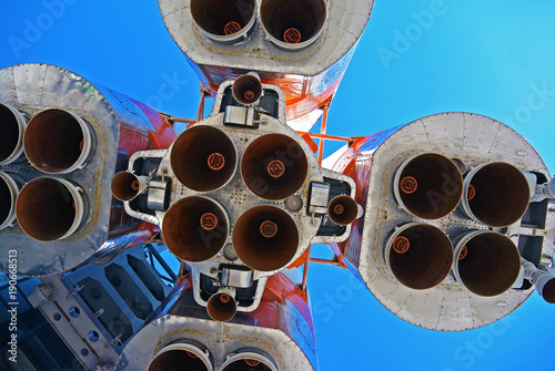 Space rocket engines of the russian spacecraft over blue sky. Cosmic hi tech background