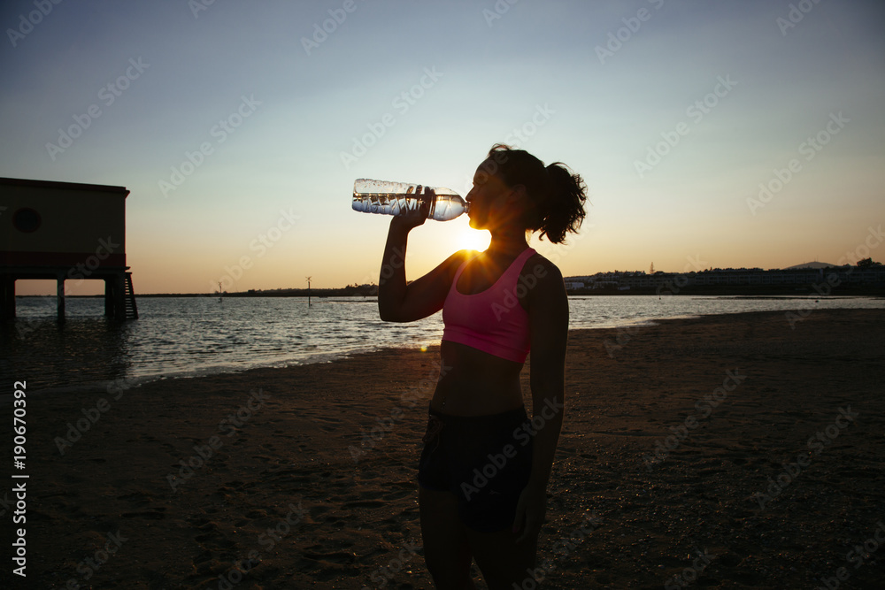 healthy woman drinking water from a bottle healthy woman drinking water from a bottle
