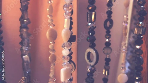 Close up of Market jewelry, bijouterie jewelry beads and bracelets. Bali island. Shopping mall. photo