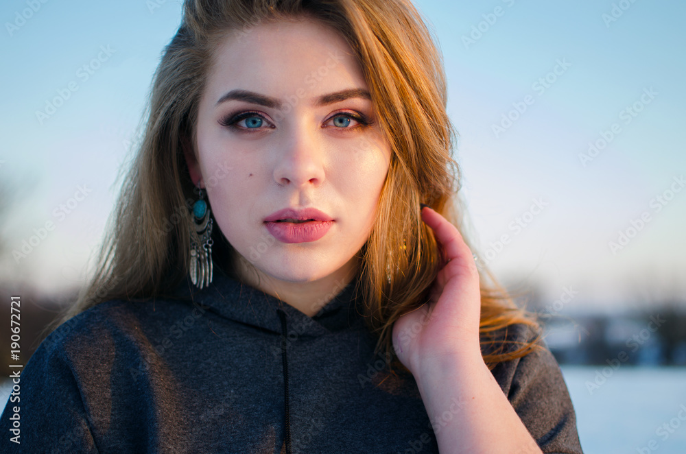 Fototapeta premium Young smiling girl in the winter