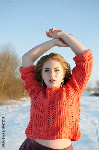 Young smiling girl in the winter