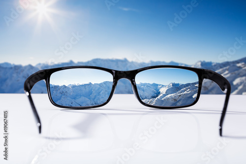 Snowcapped Mountains Seen Through Glasses
