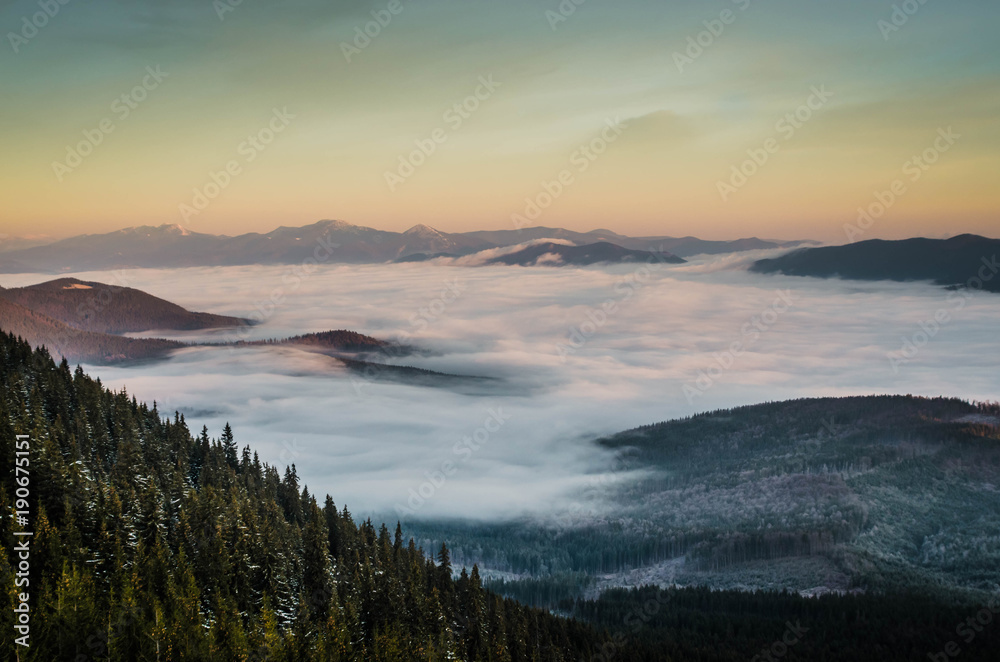 Dawn in the mountains. Foggy valley. Beautiful nature. 