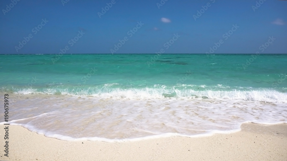 Tropical beach with white sand with beach house on a tropical island. Beautiful sky, sea. Seascape: Ocean and beautiful beach paradise. Philippines. Travel concept.